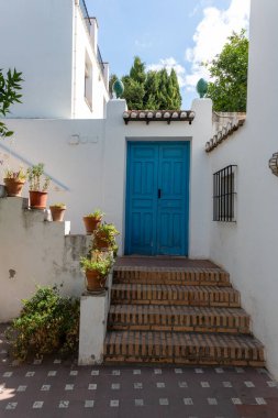 Interior view of a typical patio in Granada, featuring a central courtyard, plants, fountains, and Andalusian architecture. Perfect image for concepts of culture, architecture, tourism, history, and traditional Spanish life.