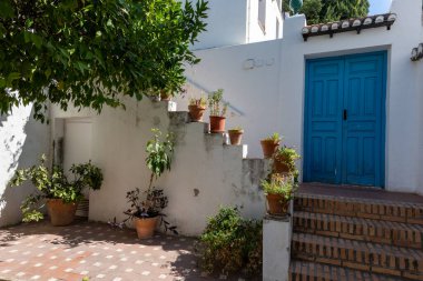 Interior view of a typical patio in Granada, featuring a central courtyard, plants, fountains, and Andalusian architecture. Perfect image for concepts of culture, architecture, tourism, history, and traditional Spanish life.