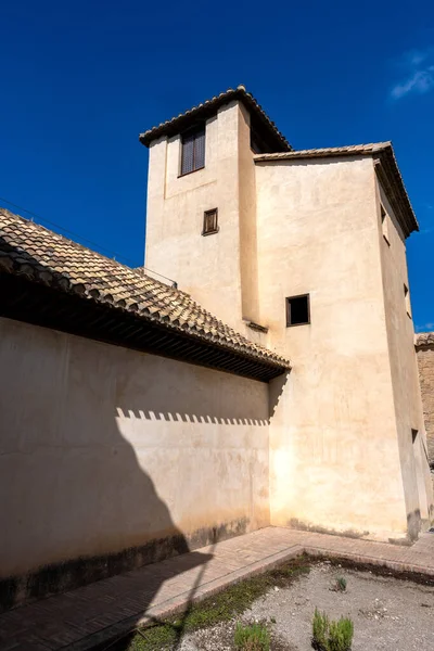 Exterior view of the Palacio de Dar al-Horra in Granada, Spain, a historic Nasrid-era palace featuring Moorish architecture. Perfect image for concepts of history, culture, architecture, and Andalusian tourism.