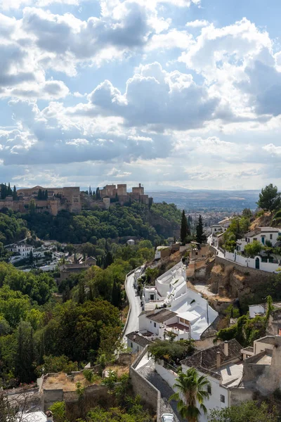 View of a walking path in the Cuevas del Sacromonte Museum in Granada, featuring traditional caves carved into the rock, typical of Andalusian architecture. Perfect image for concepts of culture, history, tourism, travel, and Spanish heritage.