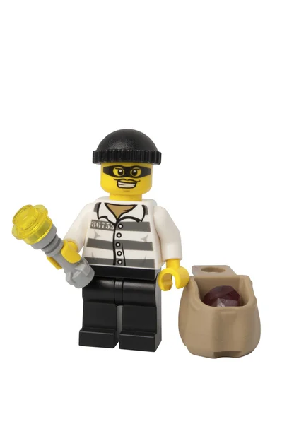 Минифигурка вора Лего — стоковое фото