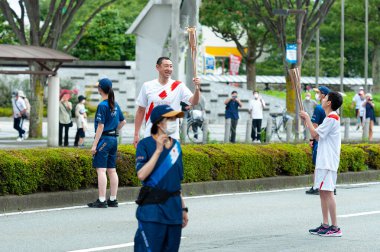 Fuji City, Shizuoka-Ken, Japan - June 24, 2021: Tokyo 2020 Olympic Torch Relay in Fuji City, Japan. clipart