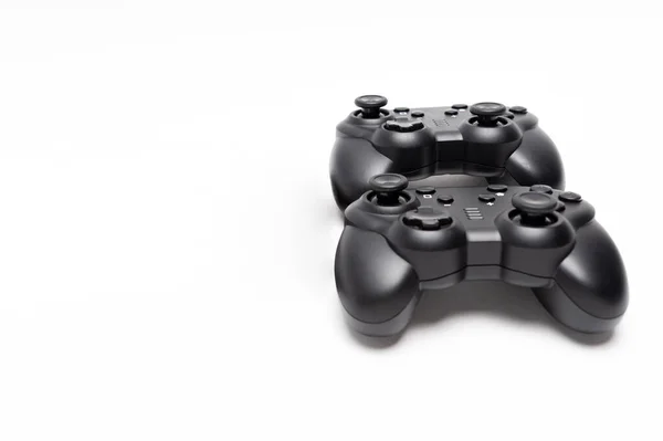 Two Generic Black Gaming Controllers Isolated White Background Copy Space — Stock Photo, Image