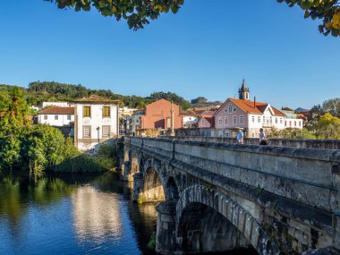 Arcos de Valdevez , Portugal; October 2020: view of the old stone bridge over the river Vez in the town of Arcos de Valdevez.