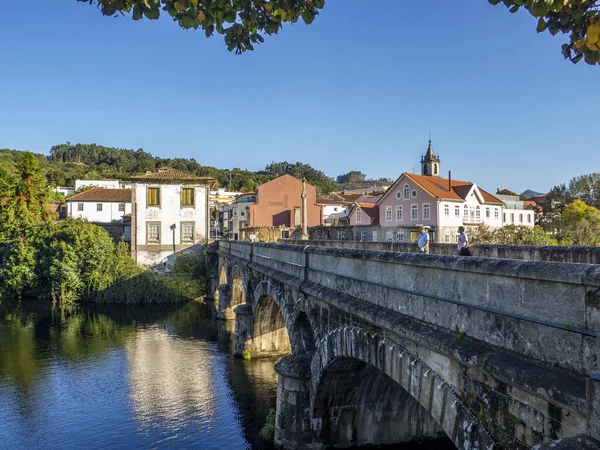 Arcos de Valdevez , Portugal; October 2020: view of the old stone bridge over the river Vez in the town of Arcos de Valdevez.
