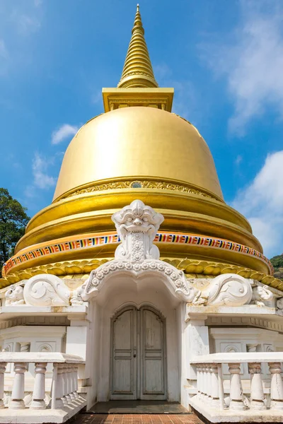 Stupa with golden dome in the monastery of the Golden Temple Dambulla. The area is a world heritage site in Sri Lanka