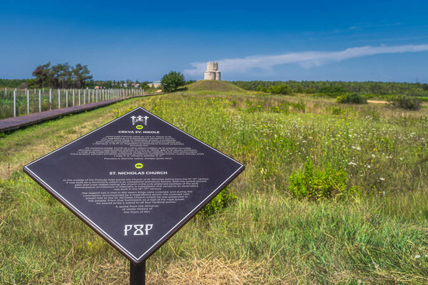 nin, croatia, July 2019 an information board or sign with historical details about the 11th century st. nicholas church between nin and zaton