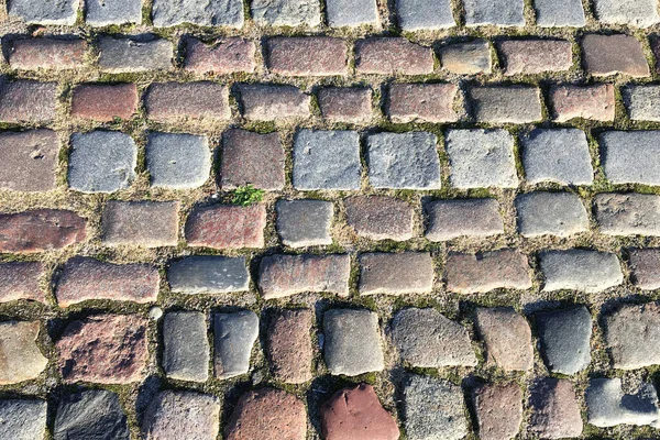 Stone pavement. Paving from paving stones of different colors. texture.