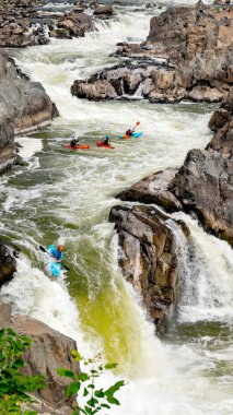 Many Kayakers take turns going over waterfall 
