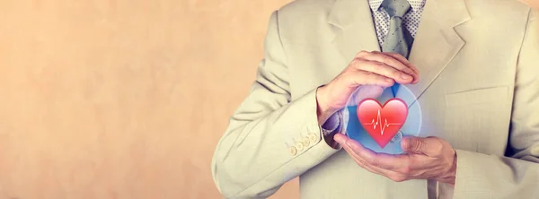 Insurance concept. Life insurance. The insurance agent holds a protective sphere with the image of the heart.