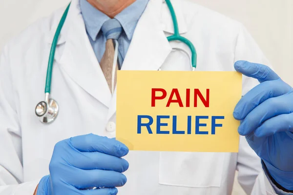 Close Male Doctor Gloves Holding Sign Text Pain Relief — Stock Photo, Image