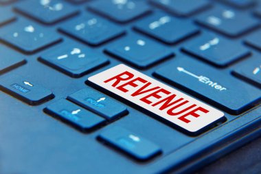 REVENUE düğmeli dizüstü bilgisayar klavyesi. Kavram, REVENUE oluşturmak için sürekli eylem anlamına gelir