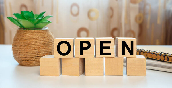 Wooden blocks with the word OPEN. Business concept