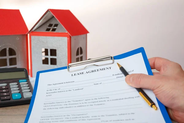 Agent Holds Form Real Estate Lease House Models Calculator — Stock Photo, Image