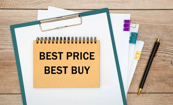 Best Price Best Buy is written on a notepad on an office desk with office accessories.