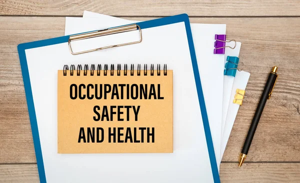 Paper with Occupational Safety and Health on the office desk, stethoscope