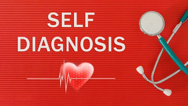 SELF DIAGNOSIS concept with stethoscope and heart shape on a red background