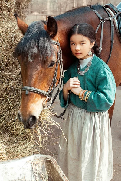 Mongolian girl with horse