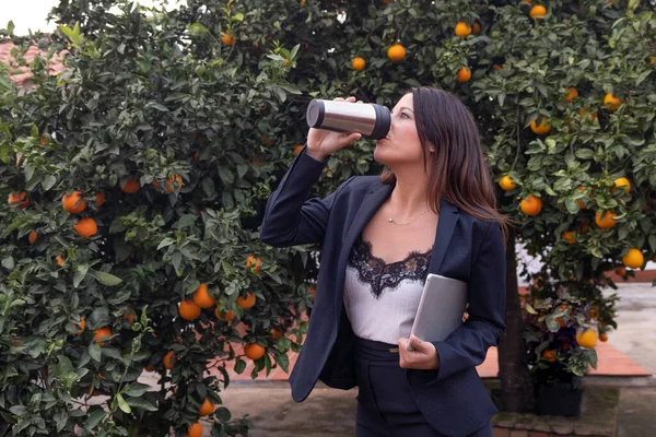 commercial woman drinks tea while resting