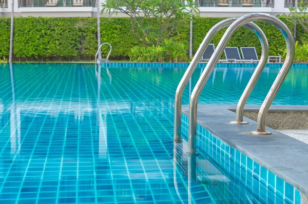 Blue swimming pool at hotel with stair — Stock Photo, Image