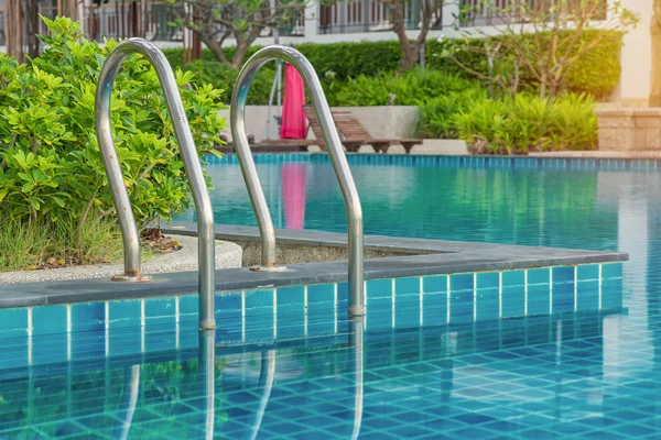 Blue swimming pool at hotel with stair — Stock Photo, Image