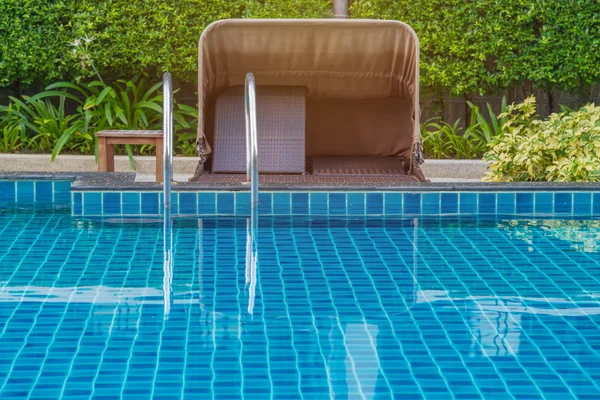 Blue swimming pool at hotel with stair — Stock Photo, Image