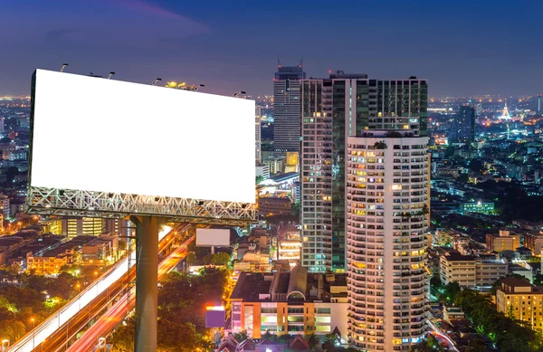 Blank billboard for advertisement in city downtown at night — Stock Photo, Image