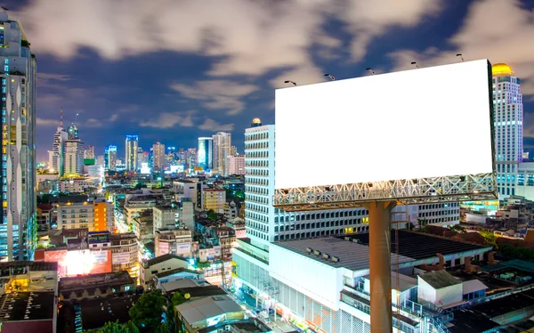 Blank billboard for advertisement in city downtown at night — Stock Photo, Image