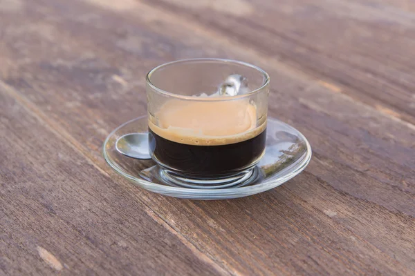 Cup of espresso on wooden table background — Stock Photo, Image