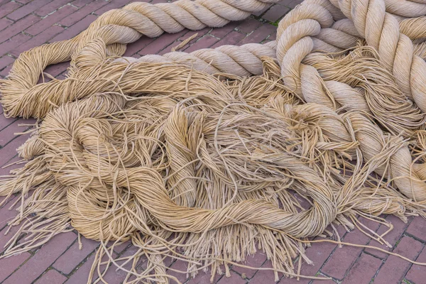 Segments of raw old rope on the floor — Stock Photo, Image