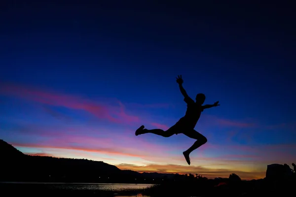 Happy Jump His Hands Sunset Lake River Freedom Concept — стоковое фото