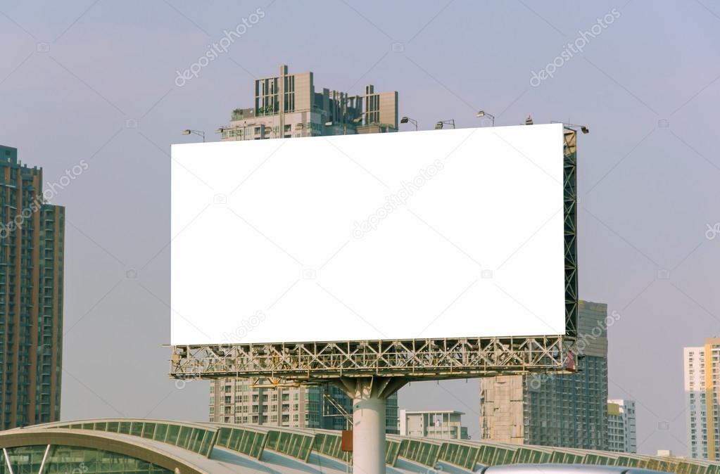 large blank billboard on road with city view background