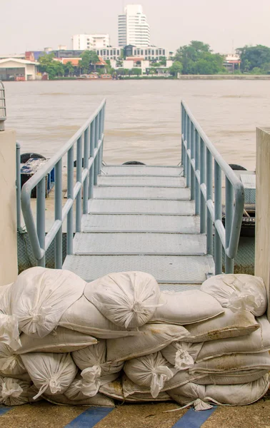 White sandbags for flood defense. — Stock Photo, Image