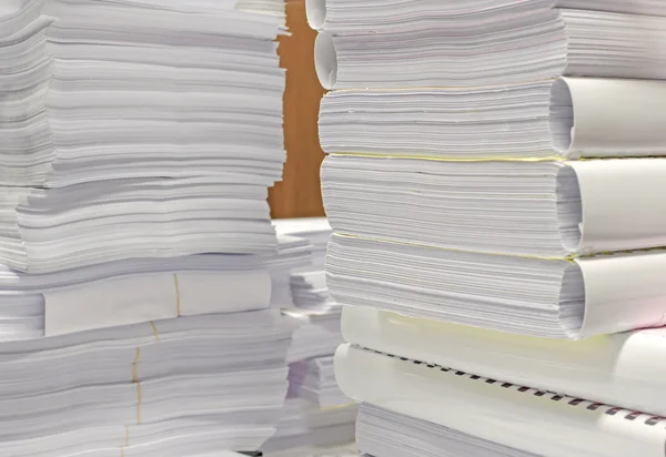 Pile of documents on desk stack up high waiting to be managed — Stock Photo, Image