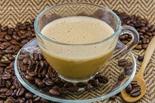 Coffee and beans on table — Stock Photo, Image