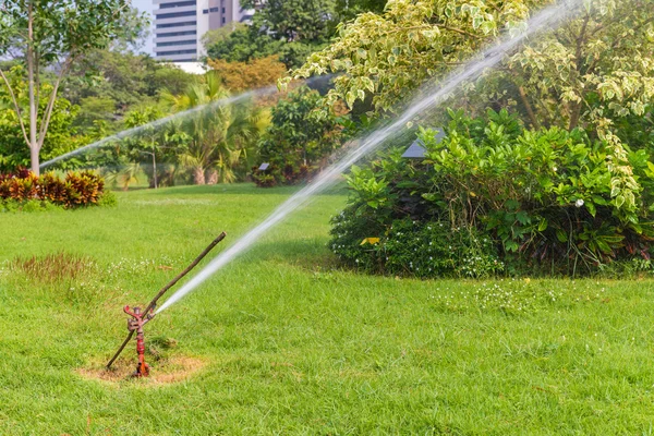 Water Sprinkler in public park — Stock Photo, Image