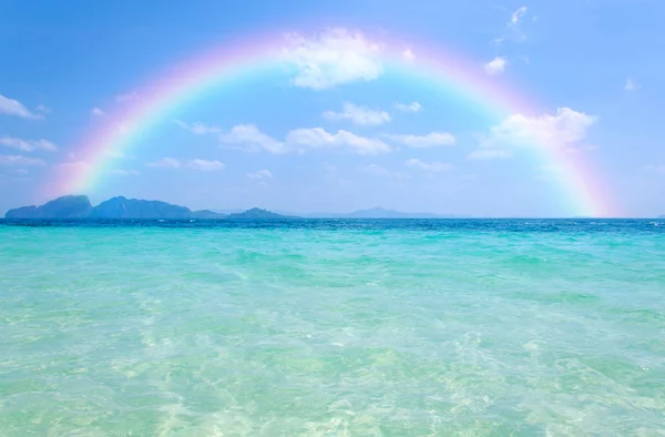 Colorful rainbow over a Tropical beach of Andaman Sea, Thailand — Stock Photo, Image