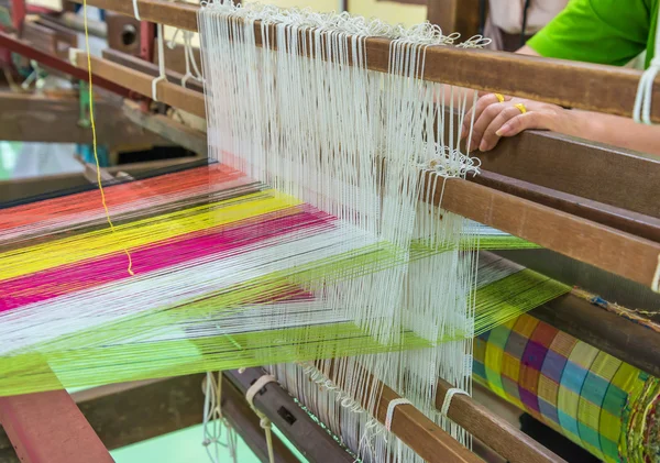 Weaving loom and shuttle on the warp — Stock Photo, Image