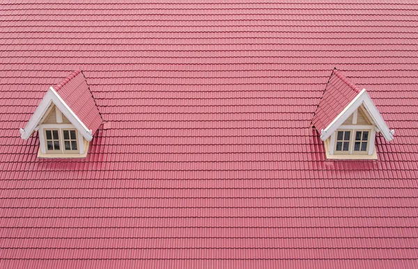 Roof with red tiles of house with white window — Stock Photo, Image