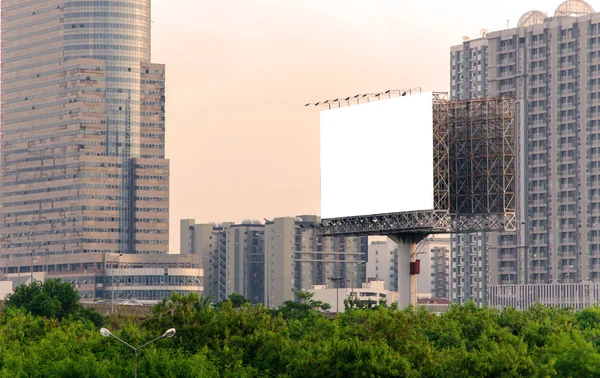 Large blank billboard with city view background. — Stock Photo, Image