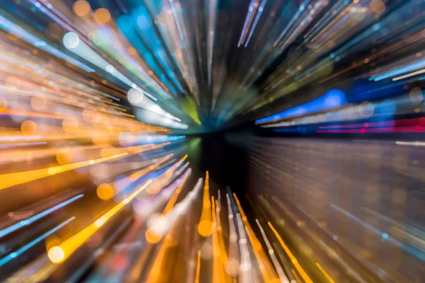 Circular abstracta de coches ligeros bokeh en la ciudad por la noche — Foto de Stock