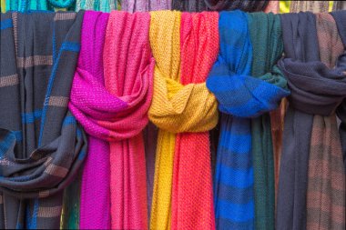 Colorful of scarves in a textiles market clipart