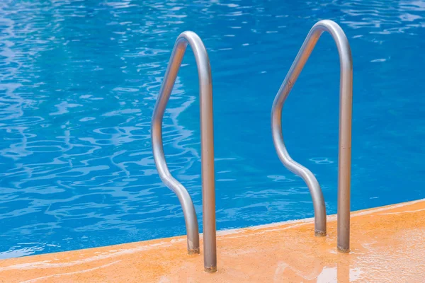 Blue swimming pool at hotel with stair — Stock Photo, Image