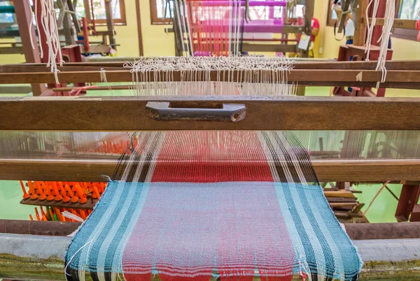 Weaving loom and shuttle on the warp — Stock Photo, Image