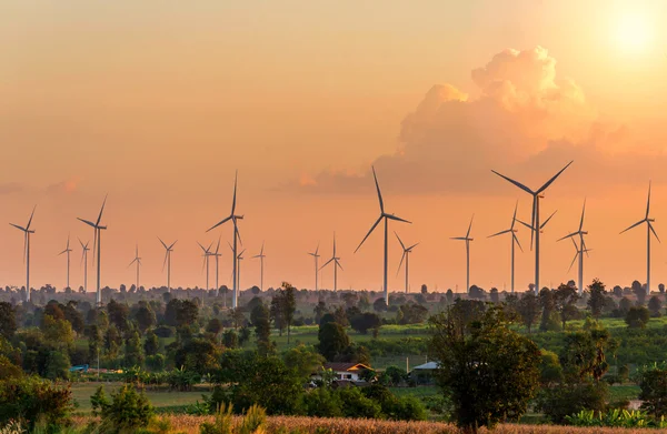 Eco power in wind turbine farm with sunset — Stock Photo, Image