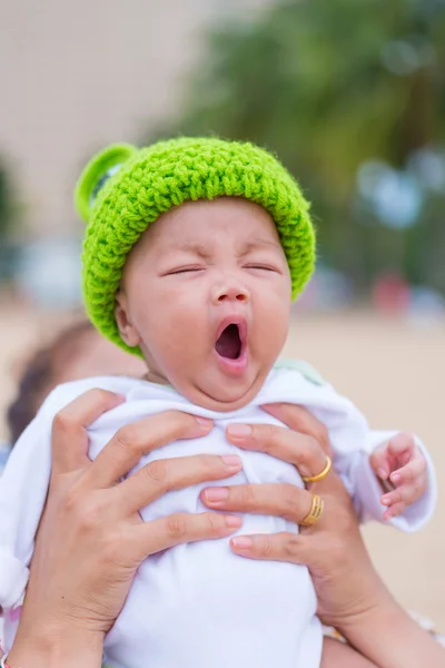 Closeup of face of yawning lying baby — Stock Photo, Image