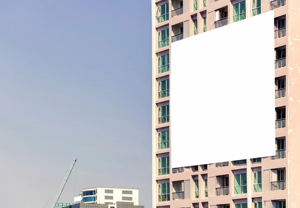 Blank billboard on building in city view background — Stock Photo, Image