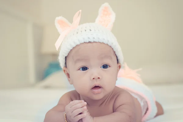 Portrait of cute newborn baby girl on the bed — Stock Photo, Image