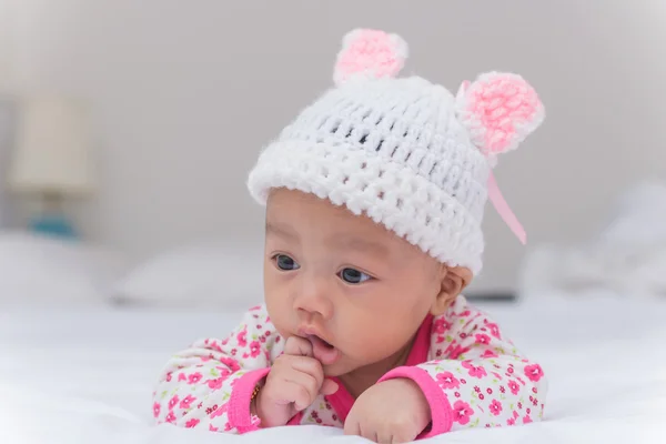 Portrait of cute newborn baby girl on the bed — Stock Photo, Image