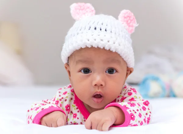 Portrait of cute newborn baby girl on the bed — Stock Photo, Image